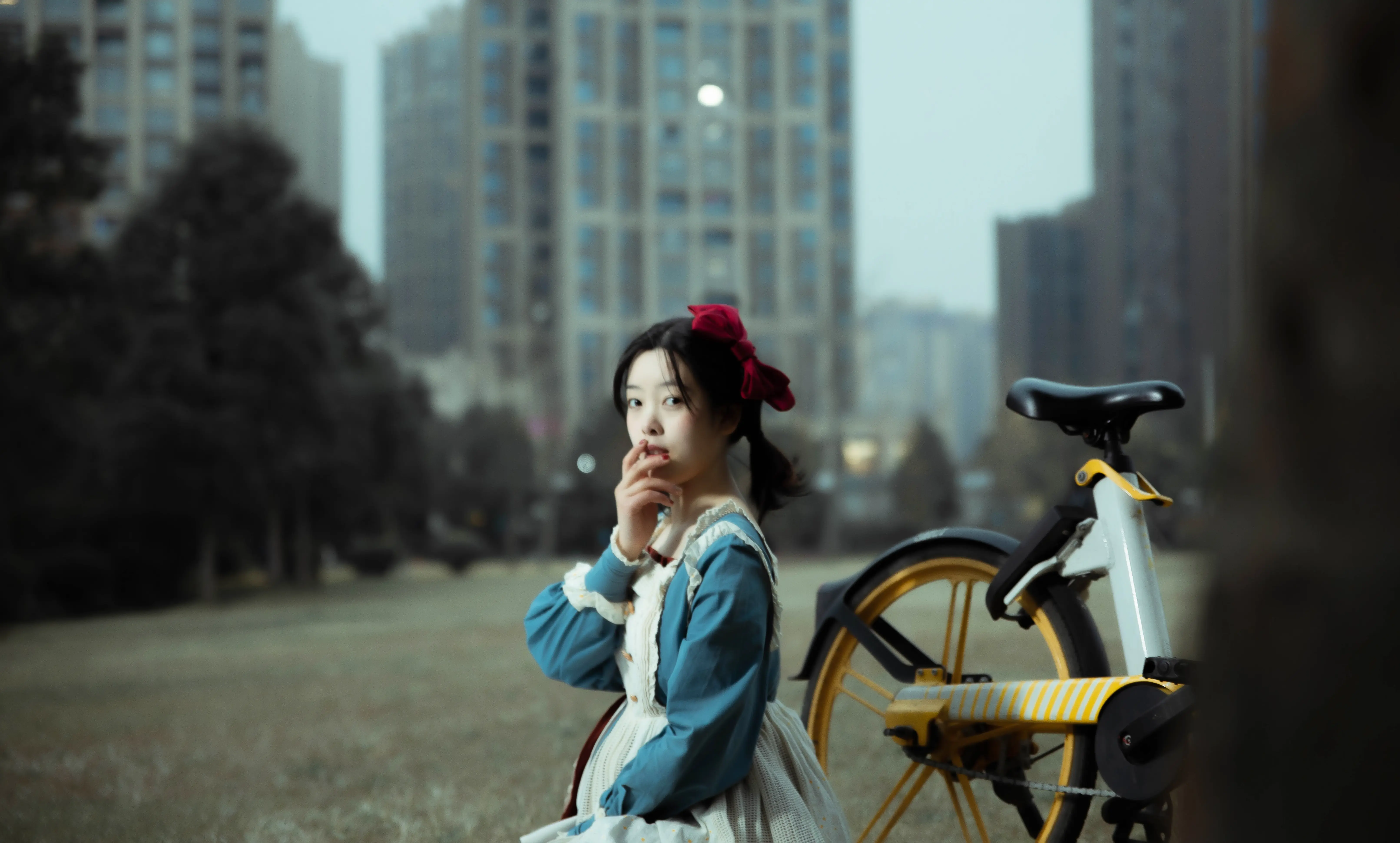 A bright pink sheet of paper used to wrap flowers curves in front of rich blue background